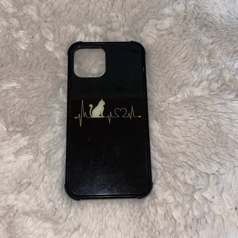 iPhone 12 phone cover preowned but hardily used perfect condition black cover